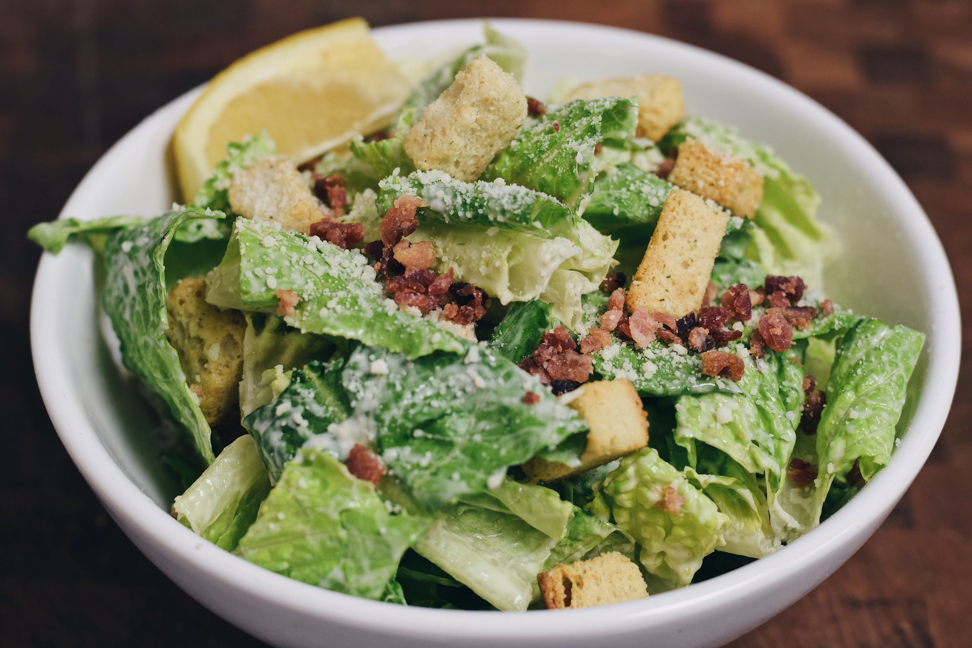 Caesar salad in white bowl closeup
